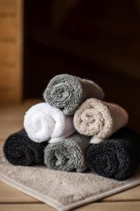 a pile of towels sitting on top of a rug at Hotel Zlaté Košice in Košice