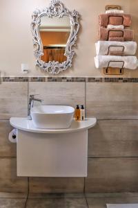 a bathroom with a sink and a mirror at Caledon 23 Country House in George