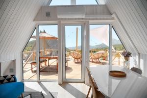 a room with a table and a large glass window at Finca Les Coves in Jijona