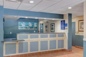 a waiting area in a hospital with blue walls at Hutchinson Island Hotel in Fort Pierce