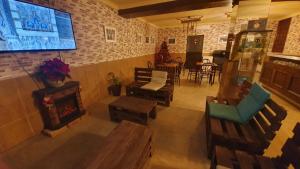 an overhead view of a living room with chairs and a fireplace at Hostal Caminito del Rey in Alora