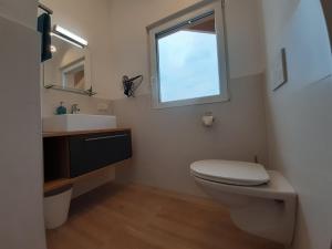 Koupelna v ubytování Haus Putzas Appartment + 10 fotografií
