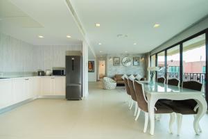 a kitchen and dining room with a table and chairs at Marrakesh huahin 4bedrooms with seaview 248 in Hua Hin