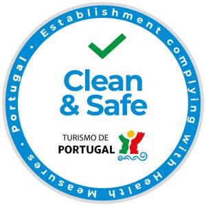 a blue clean and safe logo at Hotel Dom Vilas in Braga