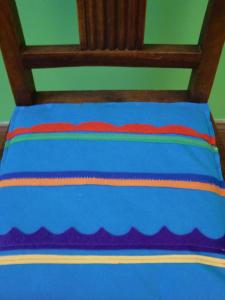 a bed with a blue comforter with a rainbow on it at CSI Coimbra & Guest House - Student accommodation in Coimbra