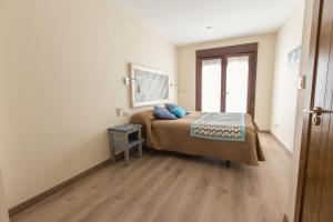 Posteľ alebo postele v izbe v ubytovaní Hostal El Gallo