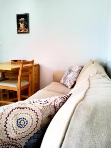 a couch sitting in a room with a table at Nefeli in Livadi