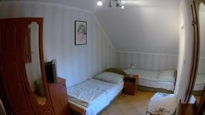 Posteľ alebo postele v izbe v ubytovaní Abigél Vendégház