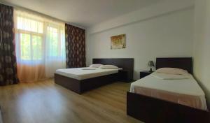 A bed or beds in a room at Vila Egreta