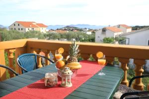Uma varanda ou terraço em APARTMANI SARLIJA