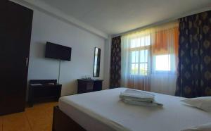 Ένα ή περισσότερα κρεβάτια σε δωμάτιο στο Vila Egreta