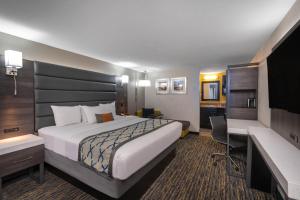 Ένα ή περισσότερα κρεβάτια σε δωμάτιο στο Baymont by Wyndham Murfreesboro