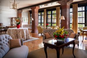 a living room with couches and a table at Parador de La Gomera in San Sebastián de la Gomera
