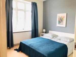 En eller flere senger på et rom på aday - 4 Bedroom - Modern Living Apartment - Aalborg