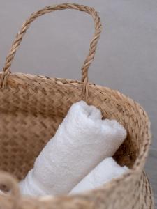 a basket filled with white towels at Bella Marbella in Marbella