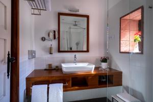 a bathroom with a sink and a mirror at Parador de La Gomera in San Sebastián de la Gomera