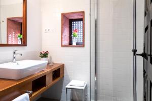 a bathroom with a sink and a shower at Parador de La Gomera in San Sebastián de la Gomera