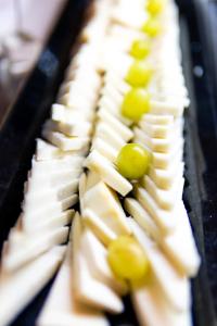 a bunch of cheese and grapes on a plate at Parador de La Gomera in San Sebastián de la Gomera