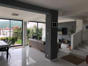 a living room with a couch and a table at Casa Doma Orsova in Orşova