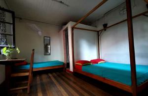 a bedroom with two bunk beds and a staircase at Hotel St-Antoine in Antananarivo +15 photos