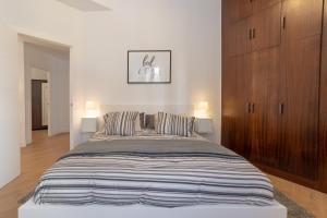 Łóżko lub łóżka w pokoju w obiekcie Bilbao High Apartment