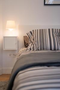 Łóżko lub łóżka w pokoju w obiekcie Bilbao High Apartment