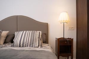 Łóżko lub łóżka w pokoju w obiekcie Bilbao High Apartment