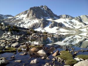 a mountain reflecting in a lake in the mountains at Mountainback #74 in Mammoth Lakes