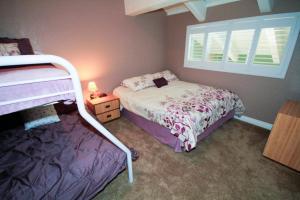a small bedroom with a bed and a window at Mammoth Ski & Racquet Club #66 in Mammoth Lakes