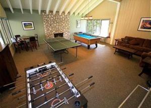 a living room with a ping pong table and a room with at Discovery 4 #137 in Mammoth Lakes