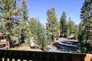 a car parked in a parking lot next to trees at Discovery 4 142 Loft in Mammoth Lakes