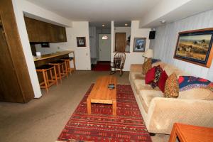 a living room with a couch and a table at Discovery 4 #135 in Mammoth Lakes
