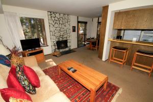 a living room with a couch and a table at Discovery 4 #135 in Mammoth Lakes