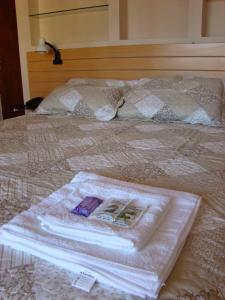 Katil atau katil-katil dalam bilik di Hotel Punta Lavalle