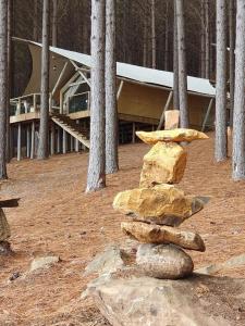 a stack of rocks in front of a building at Tedesco Eco Park in São Francisco de Paula