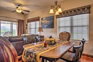 a living room with a couch and a table at 2 Mi to Attractions Pigeon Forge Condo in Pigeon Forge
