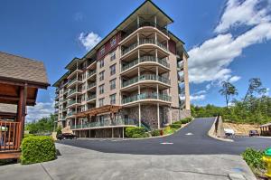 a large apartment building with a curved driveway at Pigeon Forge Condo Less Than 2 Mi to Attractions! in Pigeon Forge