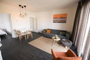 a living room with a couch and a table at Water Villa Workum in Workum