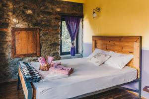 a bedroom with a bed in a room at Rancho i Vancho na Kata in Omorani +42 photos