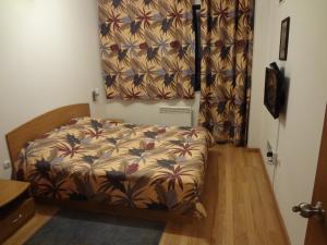 Cama o camas de una habitación en Deluxe Apartments