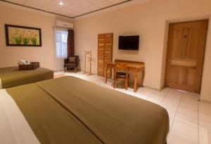 Cama o camas de una habitación en Hotel Rio Queretaro