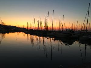a group of boats docked in a marina at sunset at Fontana in Izola