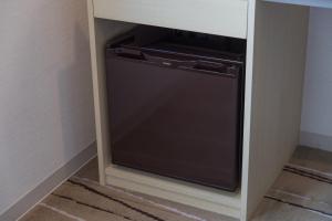 a dishwasher in a cabinet in a room at JR Kyushu Hotel Blossom Hakata Central in Fukuoka