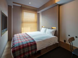 Postel nebo postele na pokoji v ubytování Twin-Line Hotel Karuizawa Japan