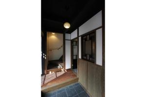 a view from the hallway of a house at Azuki an Machiya House in Kyoto +18 photos