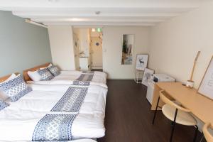 Postel nebo postele na pokoji v ubytování LUANAHOTEL IN NAKANO
