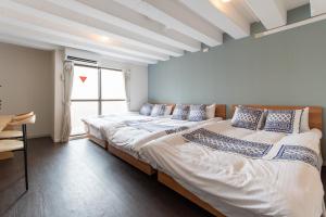 Postel nebo postele na pokoji v ubytování LUANAHOTEL IN NAKANO