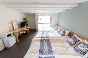 Postel nebo postele na pokoji v ubytování LUANAHOTEL IN NAKANO