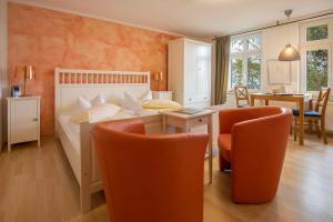 En eller flere senge i et værelse på Villa Sanssouci - Bäderstilvilla mit individuellen Wohnungen