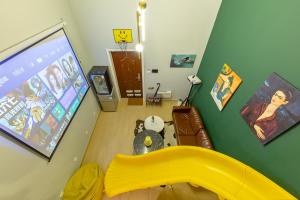 TV i/ili multimedijalni sistem u objektu loft Apartment with slide hammock with movie viewing
